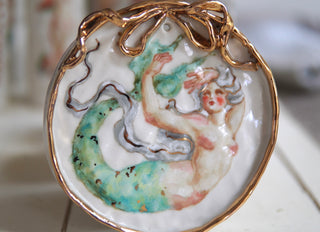 "Siren with Bow Frame" Porcelain Painting