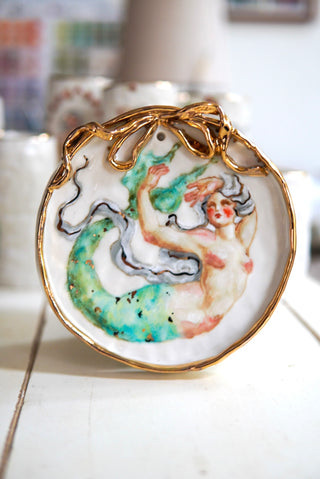 "Siren with Bow Frame" Porcelain Painting