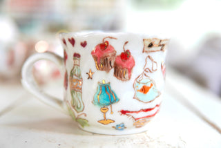 "Orange Cat, Turquoise Chair" Porcelain Mug