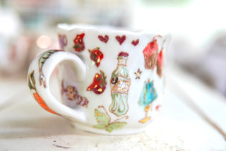 "Orange Cat, Turquoise Chair" Porcelain Mug