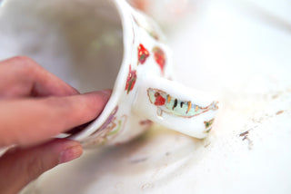 "Orange Cat, Turquoise Chair" Porcelain Mug