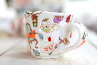 "Orange Cat, Turquoise Chair" Porcelain Mug