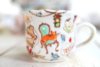 "Orange Cat, Turquoise Chair" Porcelain Mug